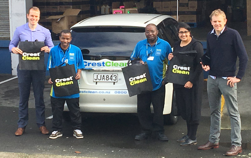 Franchisees Froduald Mugiraneza and his brother Silas receive CrestClean’s new bags for cleaning cloths. Looking on are Philip Wilson, Wellington Quality Assurance Co-ordinator, Zainab Ali, Hutt Valley Regional Manager, and Sam Lewis, Crest’s General Manager Franchise Services.