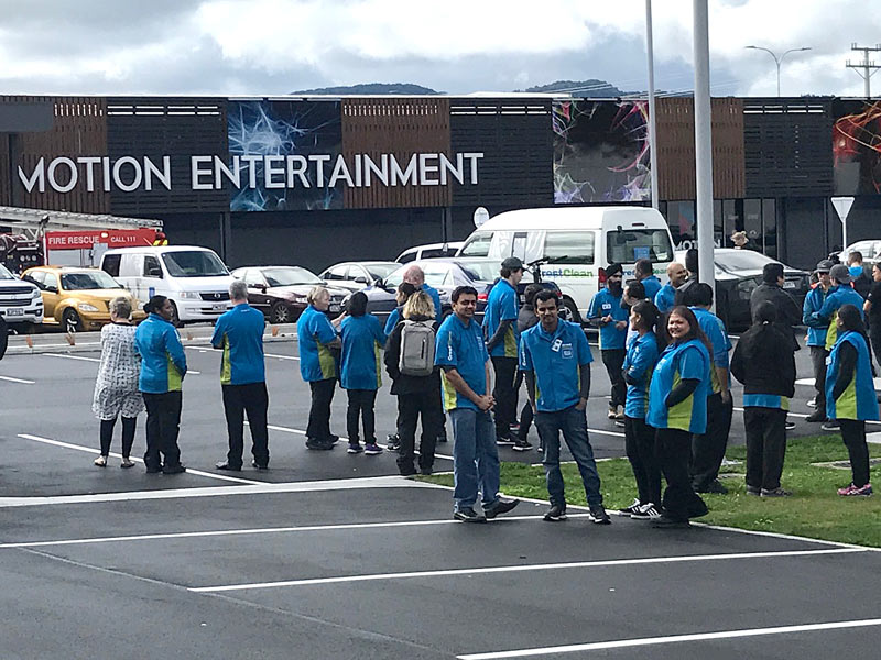 CrestClean’s Rotorua personnel outside Motion Entertainment after evacuating the building when the fire alarm went off.