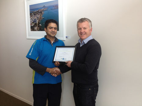 Avikash Sharma receiving his 3 Year Certificate from Grant McLauchlan. 