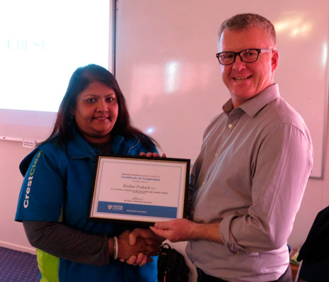 Managing Director Grant McLauchlan presented Roshni Prakash with Master Cleaners Training Institute Module 2 completion certificate.