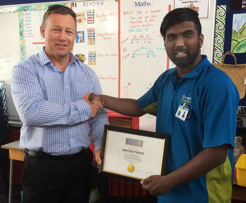 Ashitosh Prasad receives his Certificate in Commercial Cleaning Level 1 from Crest’s South Canterbury Crest Regional Manager Rob Glenie.