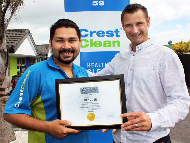 Jojy Jose receives his Certificate in Commercial Cleaning Level 1 from Jan Lichtwark. 