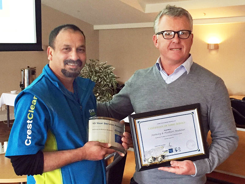 Anthony Mudaliar receives his 10-year Long Service Award from CrestClean Managing Director Grant McLauchlan.