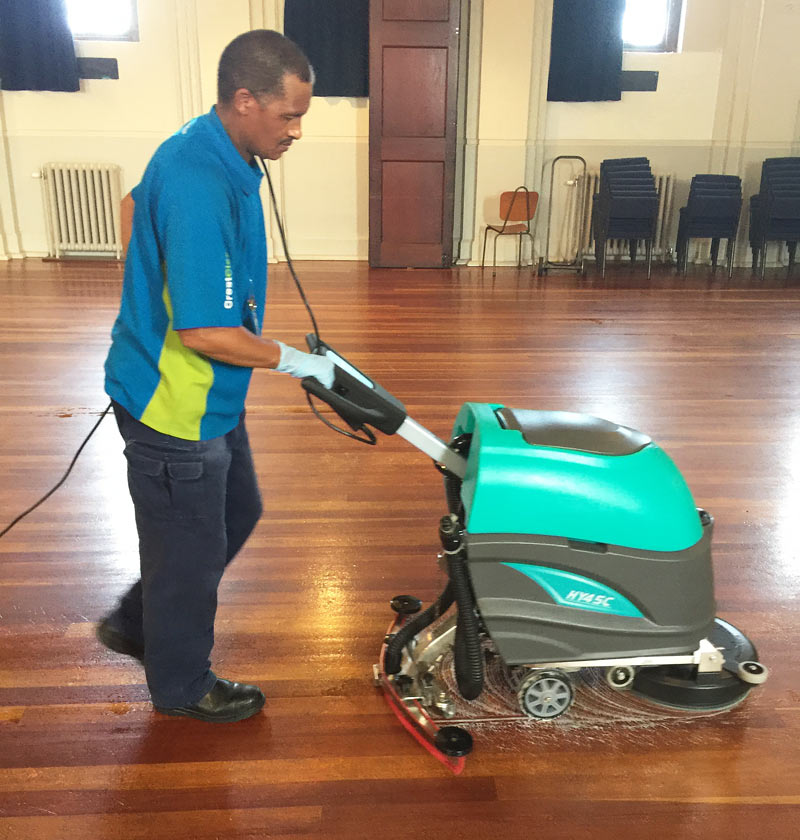 Franchisee Hary Ficks using a brand new automatic scrubber.