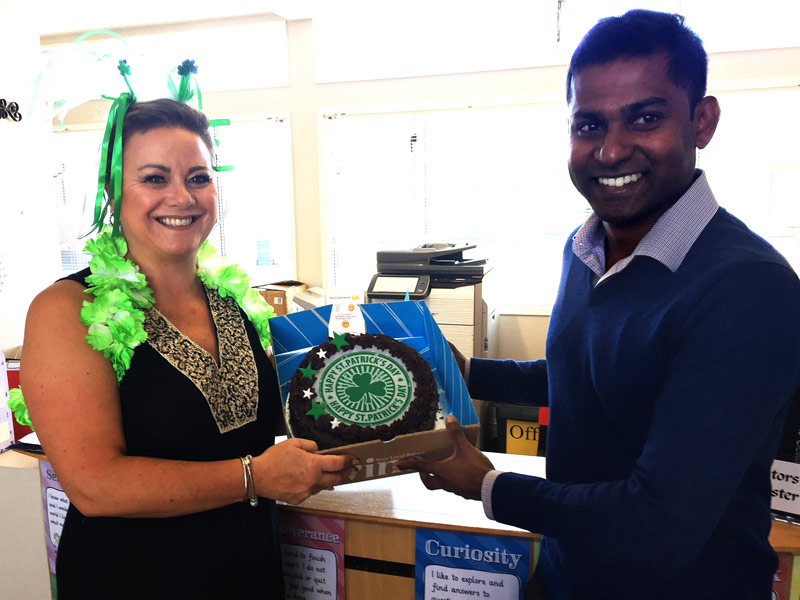 Angela Stuart, School Secretary at St Patrick’s School, Kaiapoi, with the surprise cake delivered by Yasa Panagoda.