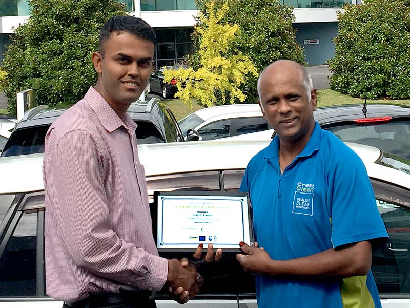 Ashveen Raju receives his Certificate of Long Service Award from Neil Kumar, CrestClean’s North Harbour Regional Manager.