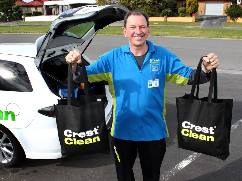 Tauranga franchisee Malcolm Brown helps road test the new CrestClean bags. 