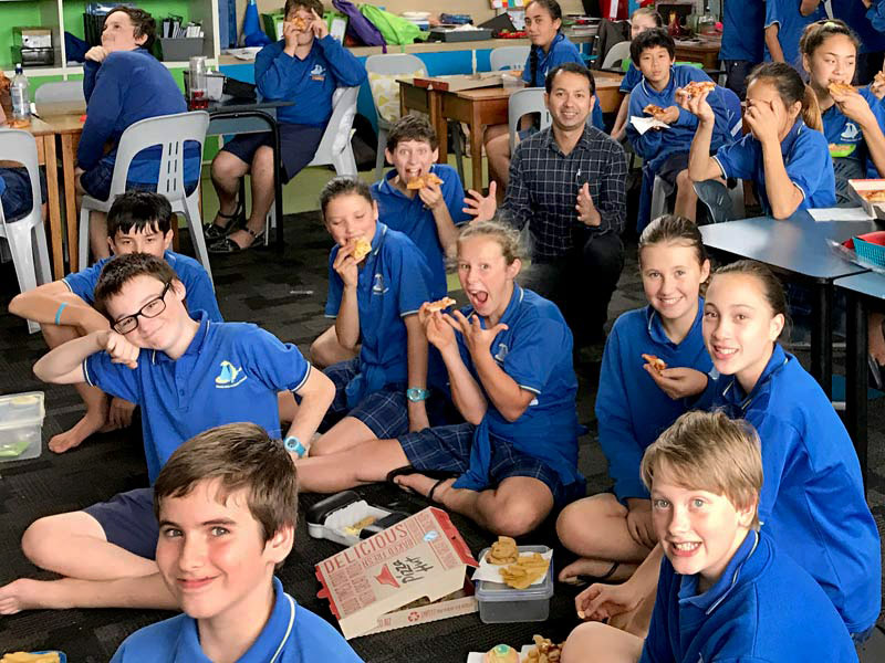 Prasun Acharya was thrilled to deliver pizza to students at Devon Intermediate School, New Plymouth, as a reward for keeping their classroom clean and tidy.