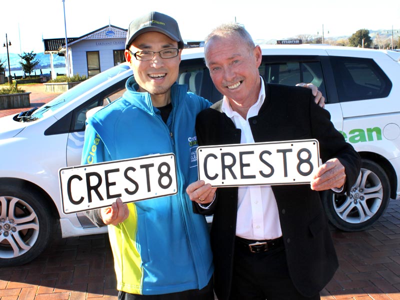 Regional Manager Bill Douglas presents William Lin with his prize number plate.