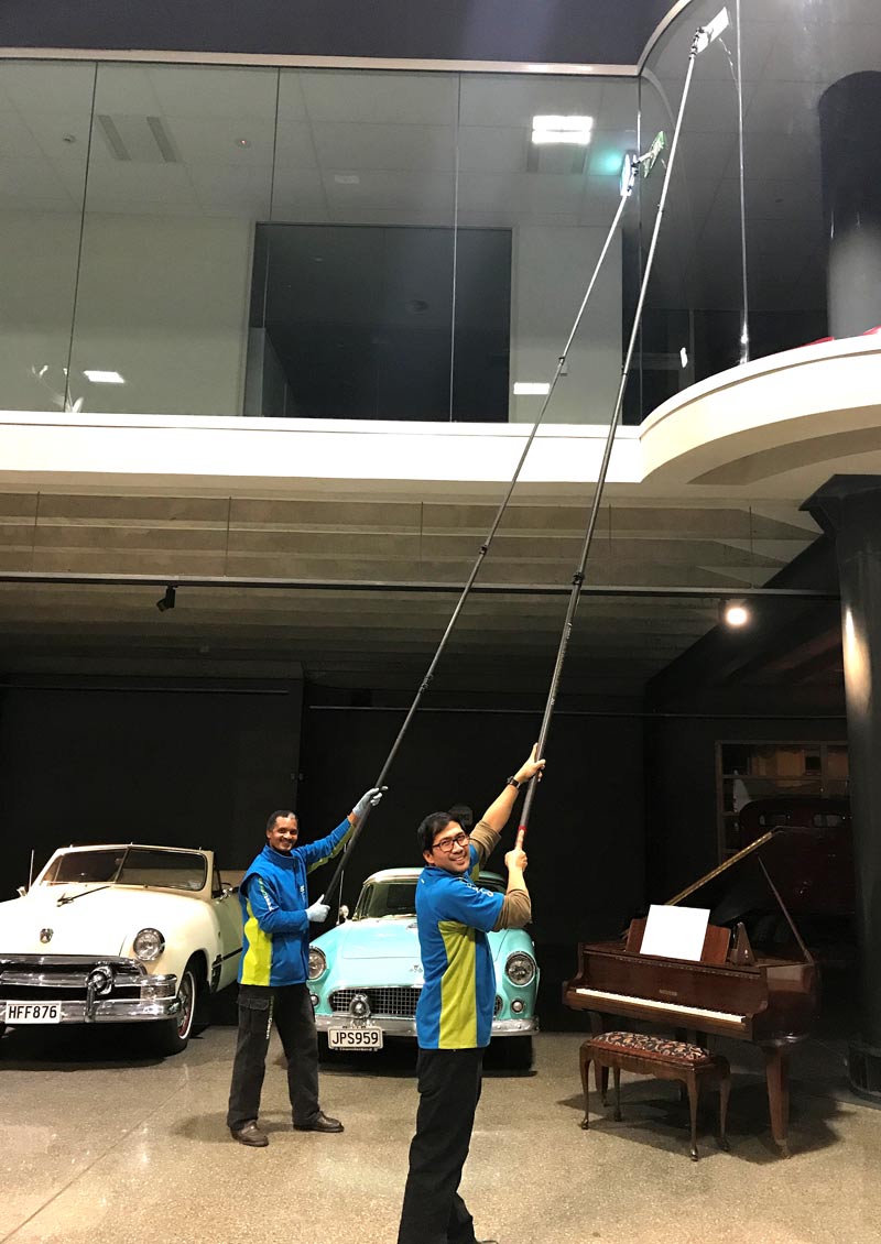 Franchisee’s Martyn De Guzman and Harry Ficks at work on the windows at Invercargill’s Bill Richardson Transport World. 