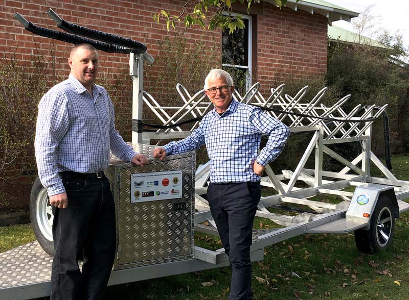 James Dixon with Clyde School Principal Doug White and the new bike trailer.