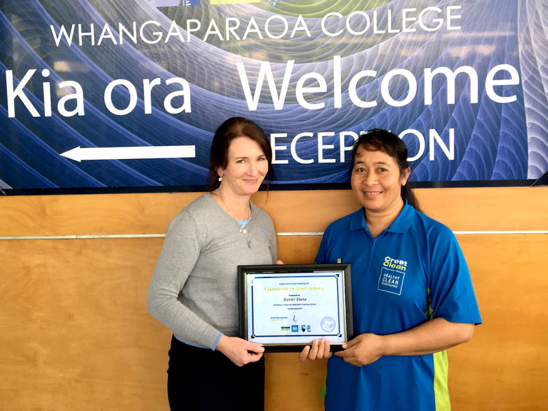 Karite Eneta receives her Certificate of Long Service from Ginny Catterall at Whangaparaoa College.