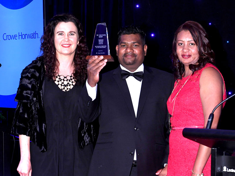 Dan Pariachi and Madhu Mala receive their Award from Michelle Malcolm of Crowe Horwath (left).