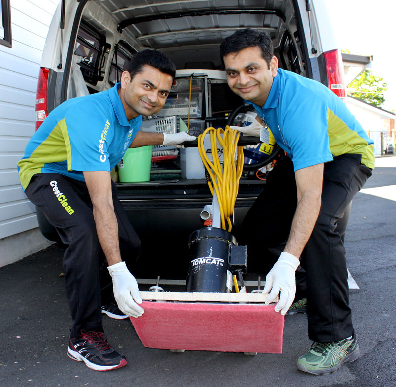 Pinakin and his brother Hitesh unload the The TomCat floor scrubber.