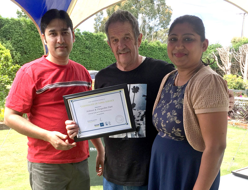 Ashneer and Durgeshni Datt receive their Certificate of Long Service from Glenn Cockroft. 