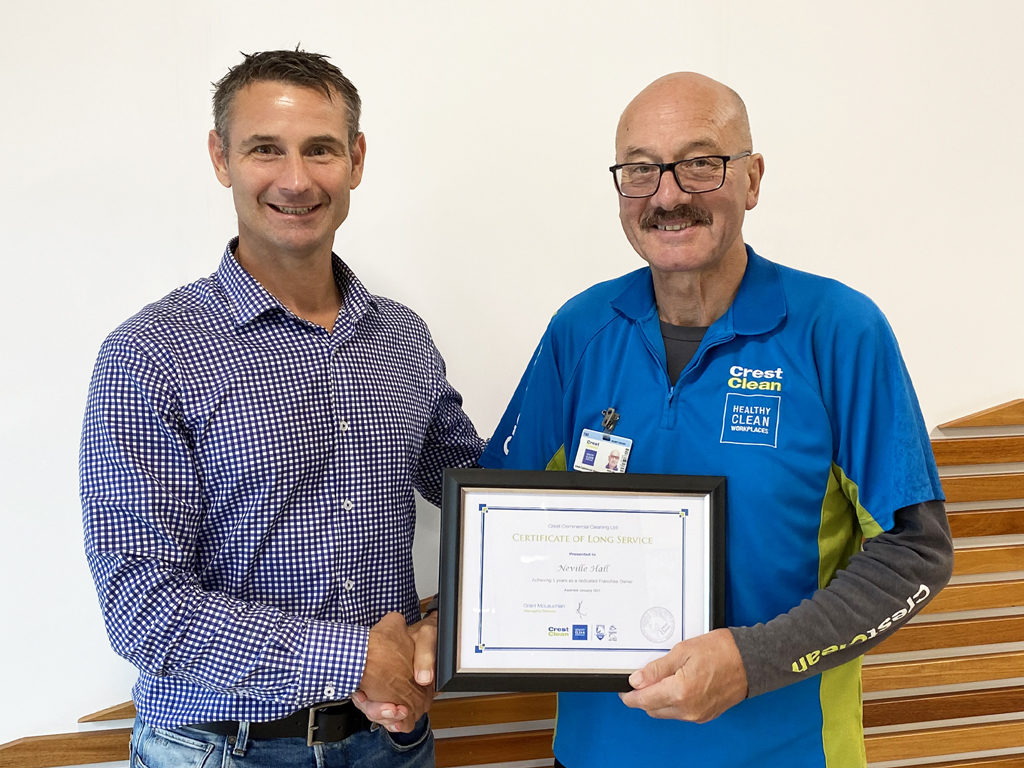 Cleaner receives long service award.