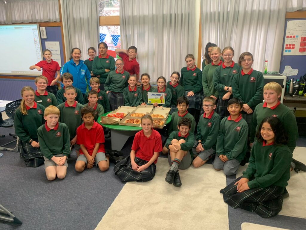 School pupils with pizza.