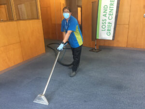 Cleaner using a carpet cleaning machine.