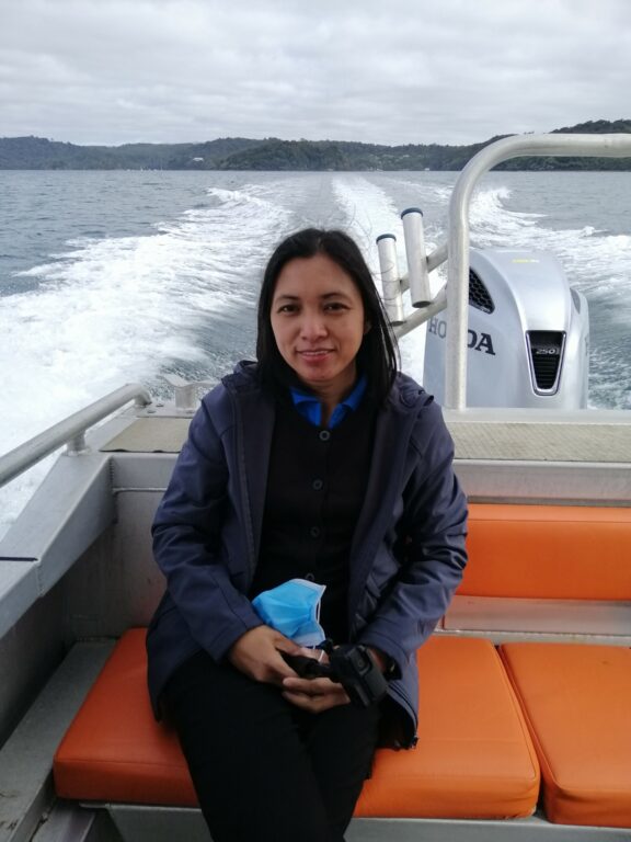 Woman sitting on board a boat.